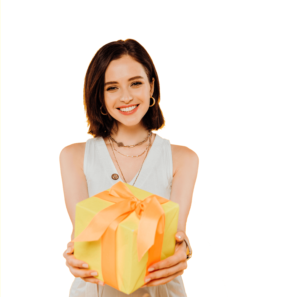 Smiling girl with a yellow gift box.